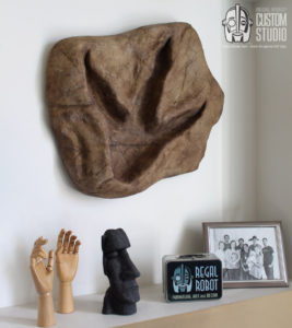 t-rex footprint wall art sculpture