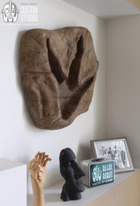 t-rex footprint wall art sculpture